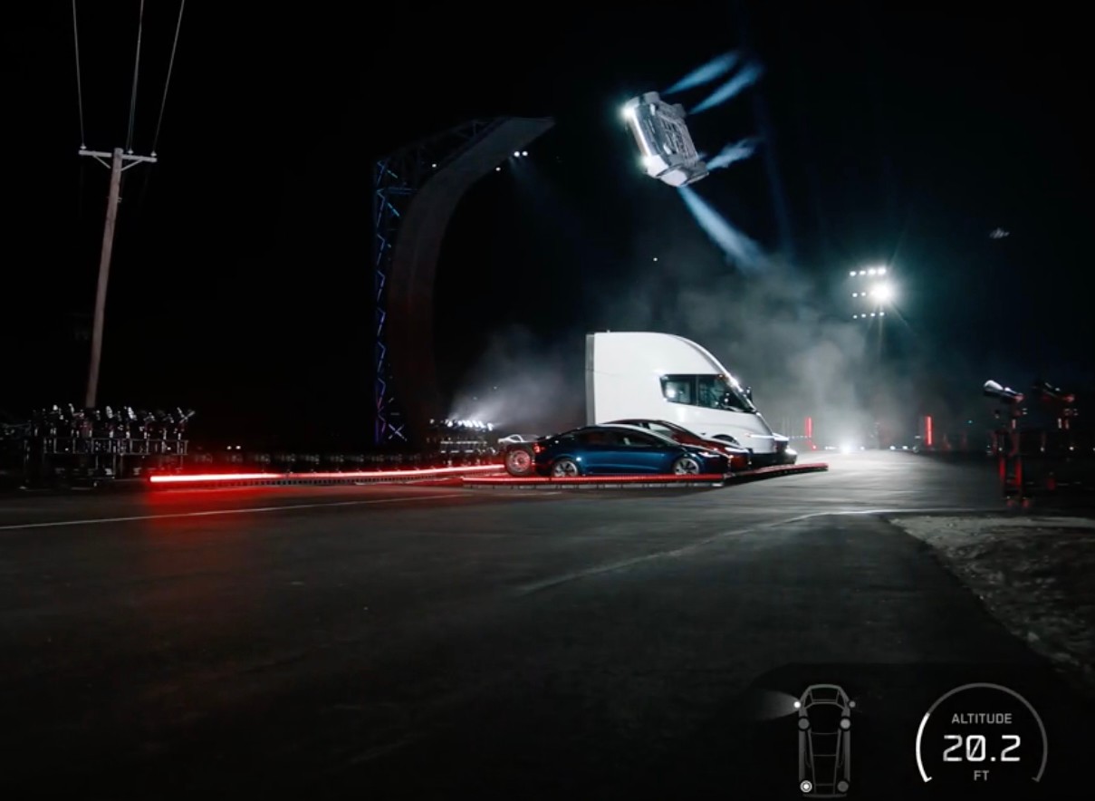 Tesla's redesigned Roadster airborne above its vehicle lineup at the Texas unveiling. Photo: Tesla.